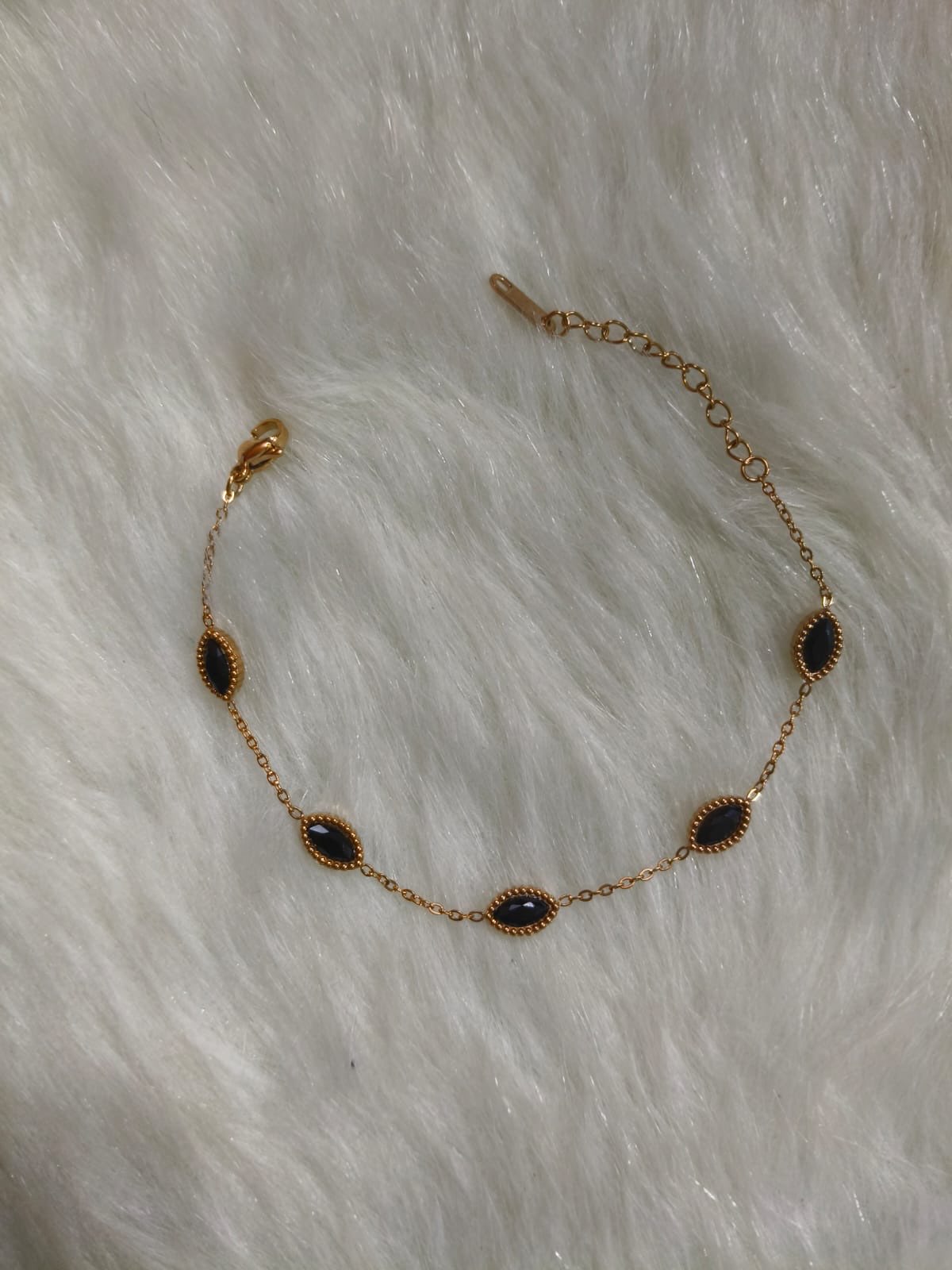 Rose gold bracelet with black stone
