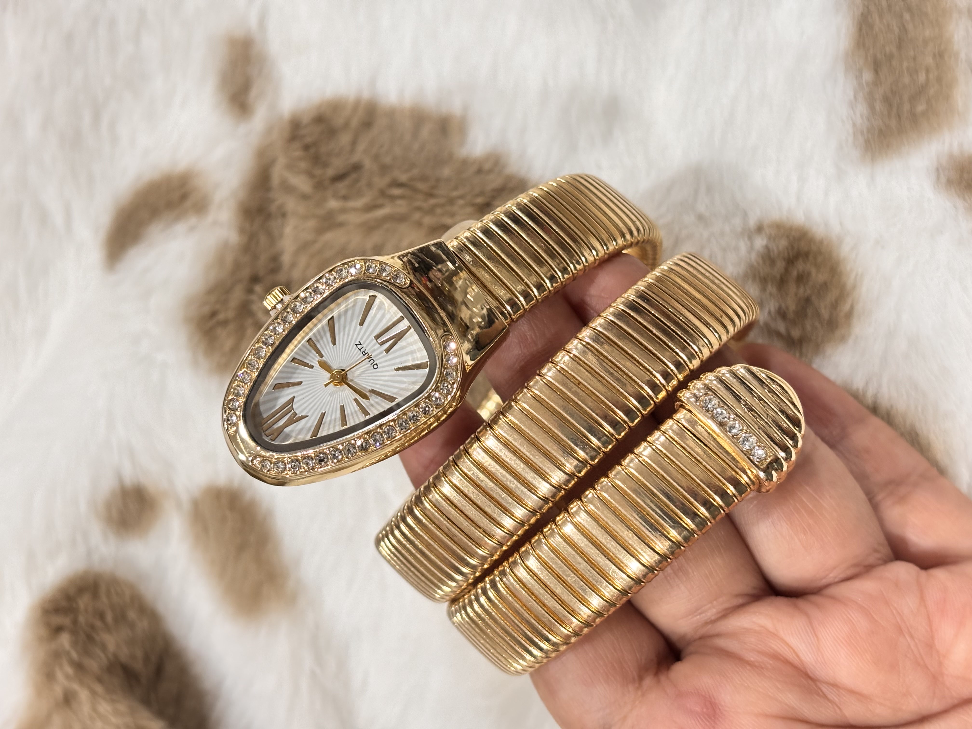Gold snake watch