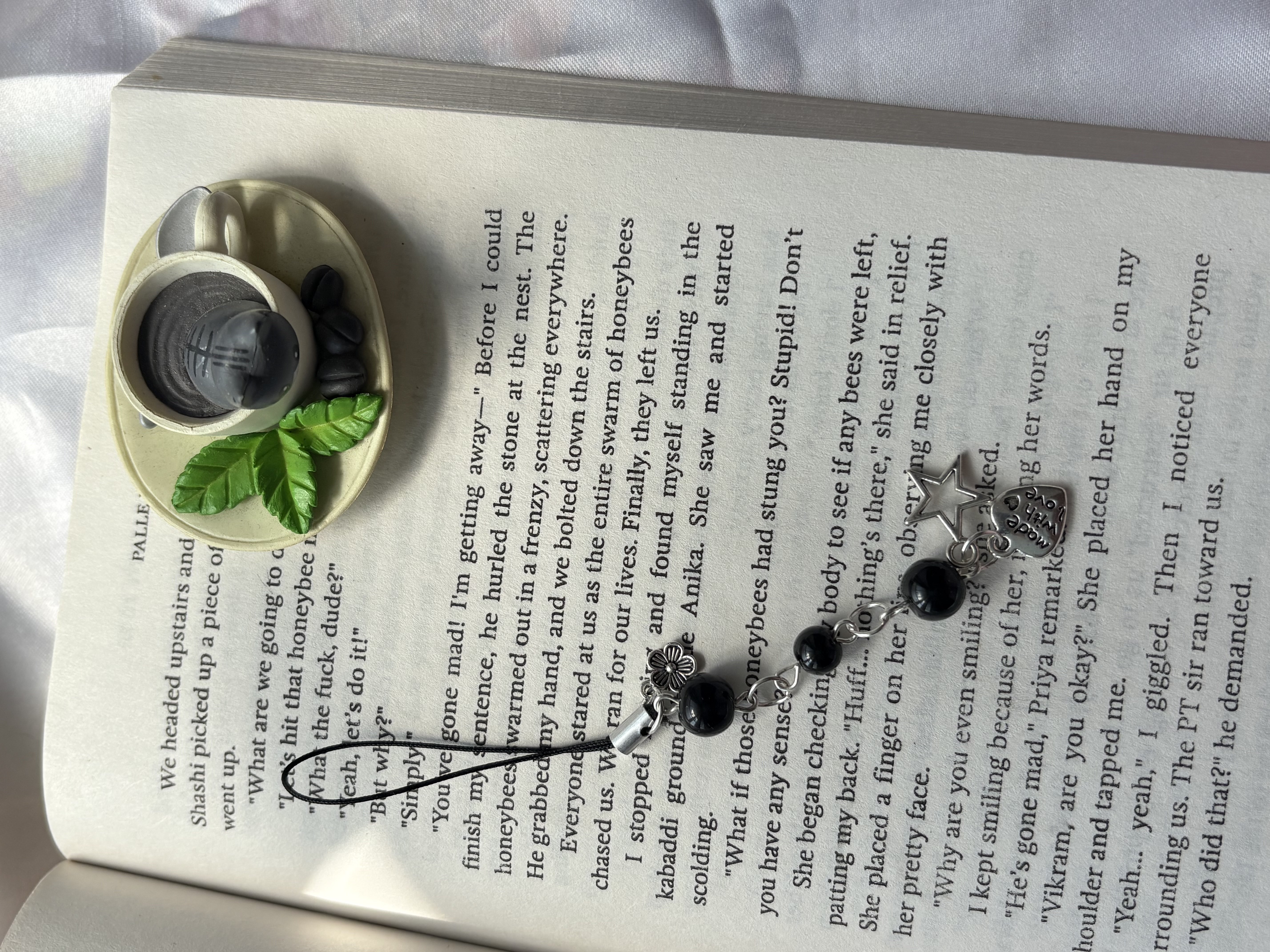 black bead phone charm